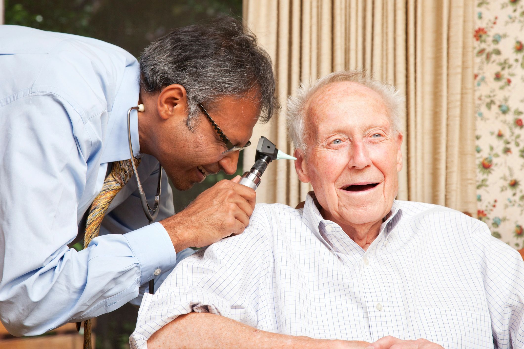 Senior patient receiving supportive hearing care