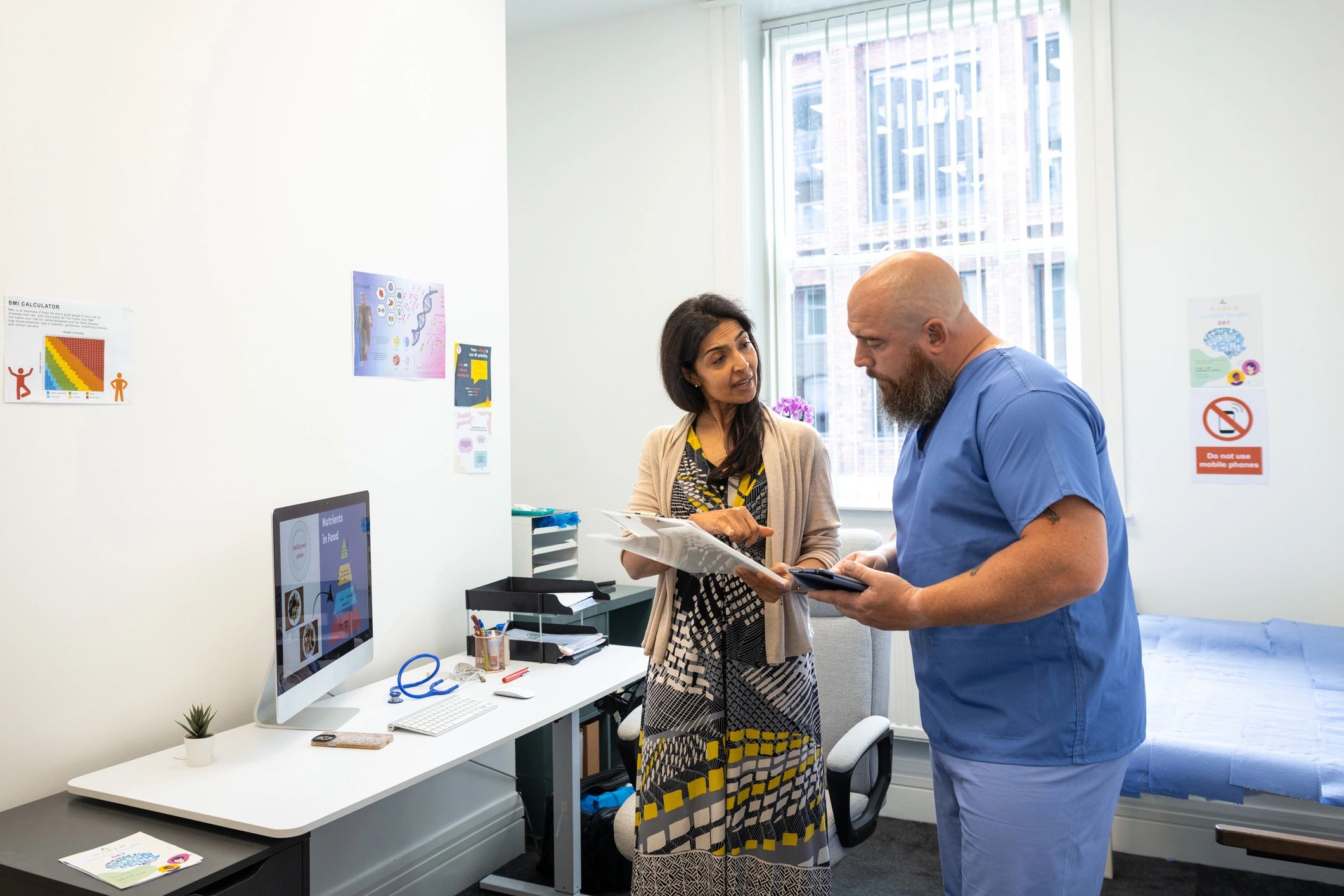 Healthcare professionals reviewing patient information in a clinic